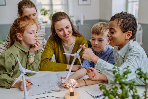 Children gathered around a table with a teacher